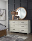 Vista - 6 Drawer Dresser & Round Mirror in Hickory & Shell