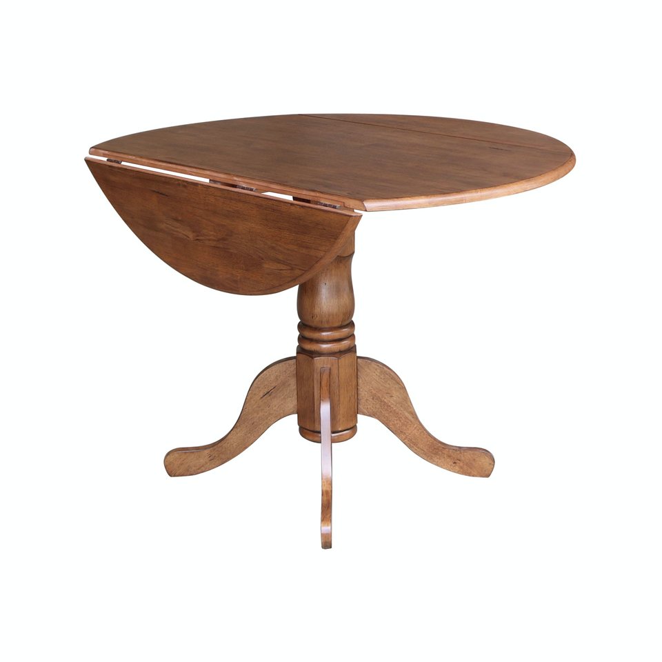 Dining Essentials - Round Drop Leaf Pedestal Table in Bourbon Oak