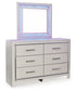 Zyniden King Upholstered Panel Bed with Mirrored Dresser, Chest and Nightstand