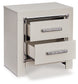 Zyniden King Upholstered Panel Bed with Mirrored Dresser, Chest and Nightstand