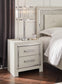 Zyniden King Upholstered Panel Bed with Mirrored Dresser, Chest and Nightstand