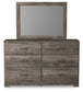 Ralinksi Queen Panel Bed with Mirrored Dresser and Chest