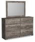 Ralinksi Queen Panel Bed with Mirrored Dresser and Chest