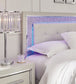 Zyniden King Upholstered Panel Headboard with Mirrored Dresser and Nightstand